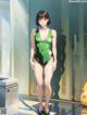 A woman in a green and black bathing suit standing in a room.